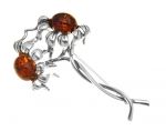 Sunflower silver brooch with brown amber